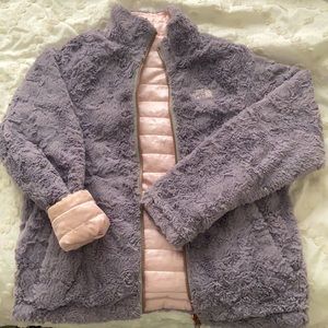 A reversible grey and metallic pink NorthFace coat